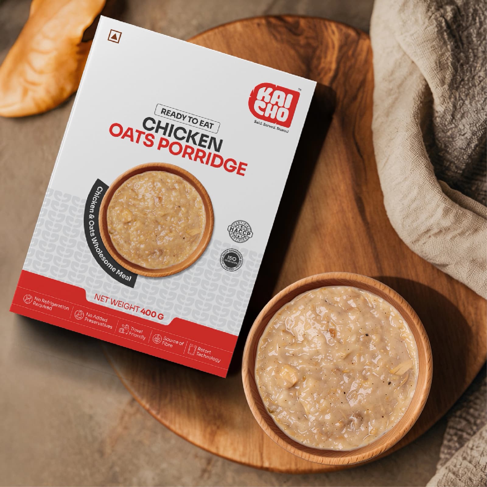 Kaicho Chicken Oats Porridge 400 g pack with a wooden bowl of porridge