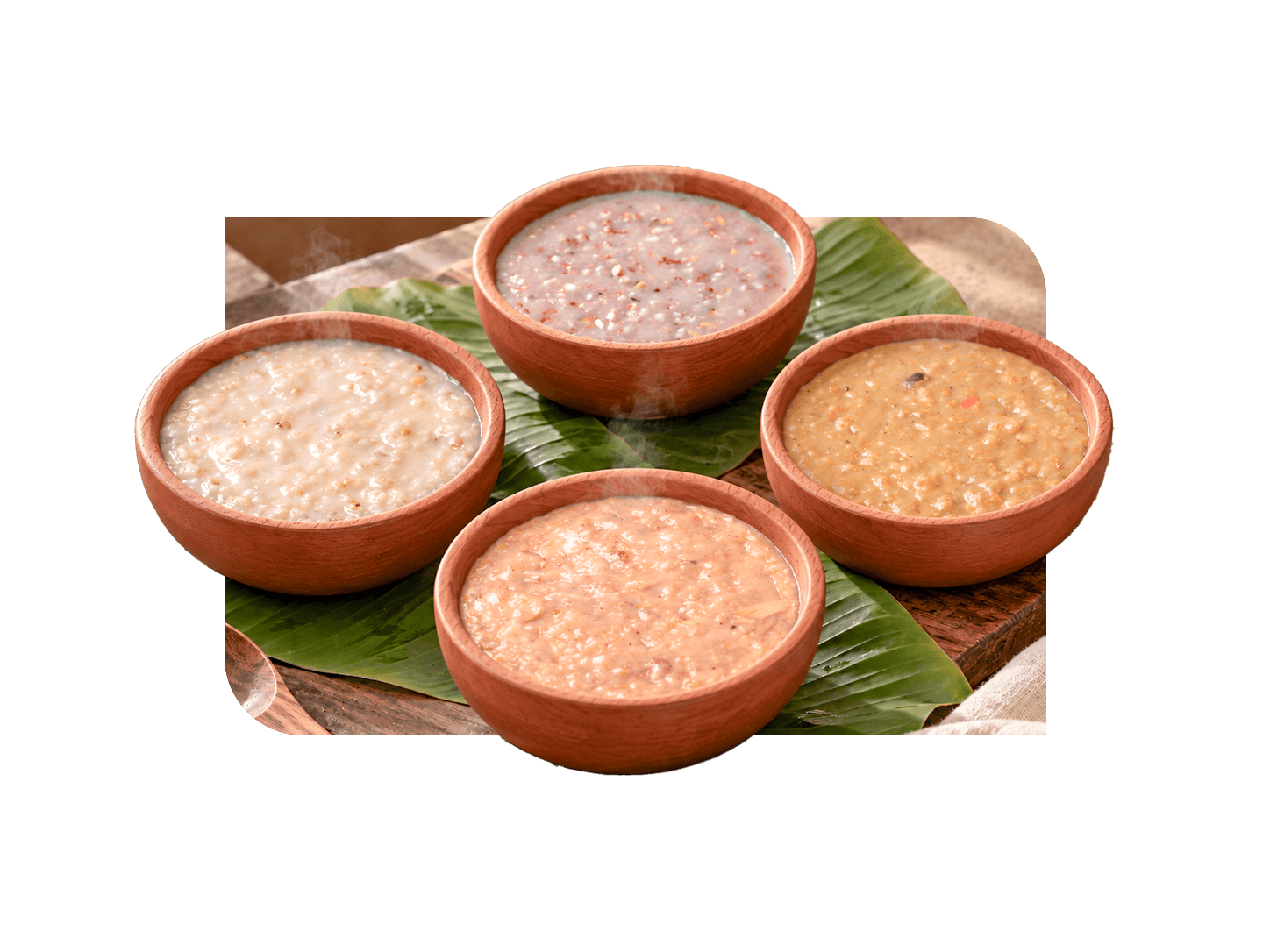 Four bowls of Kaicho millet porridge served on banana leaf